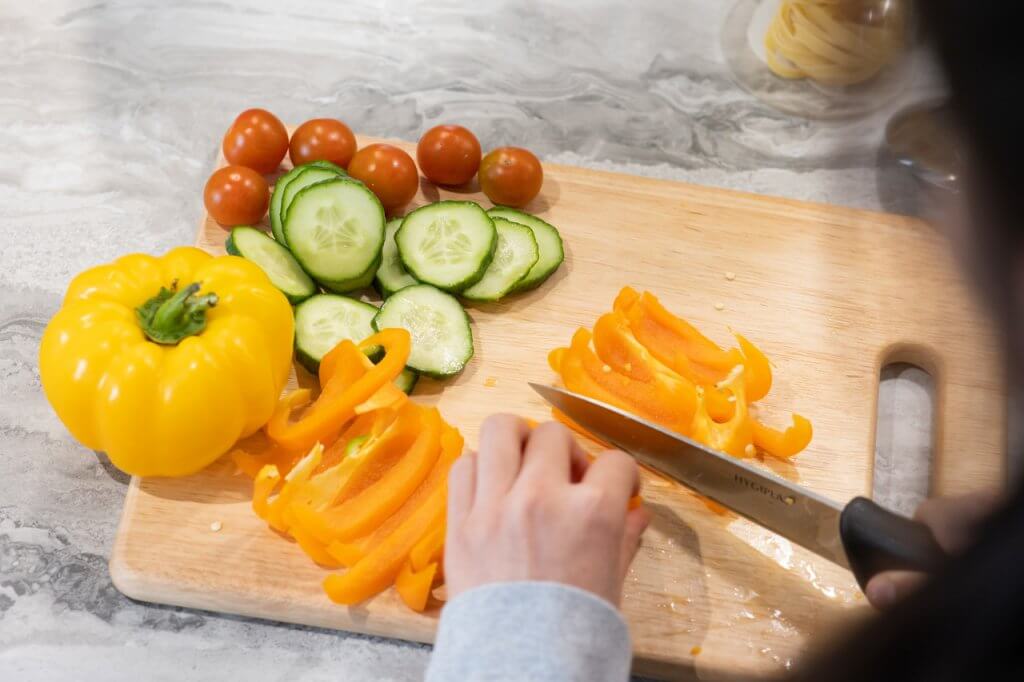tomatoes, peppers and cucumbers being cut up in Veganuary