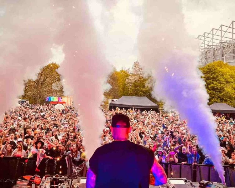 a dj on stsage performing at a top uk festival to visit this summer